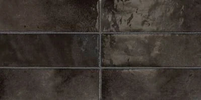Détail du carrelage mural Artisan Graphite, faïence effet zellige brillant